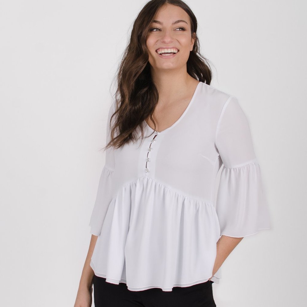 Loose white blouse with flared sleeves and V-nec